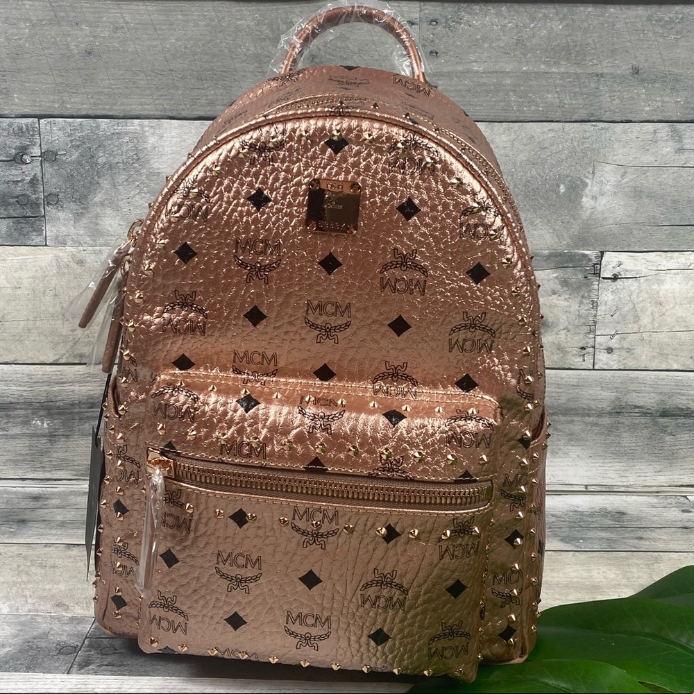 New-like - MCM champagne gold rose studded backpack Dimensions 10.5 x 5 x 13”-H